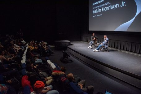 Wide photo of Kelvin Harrison Jr smiling during TIFF Next Wave Q&A