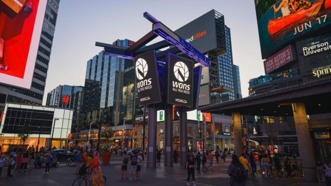 Yonge and Dundas Square billboards with Nick Wons logo