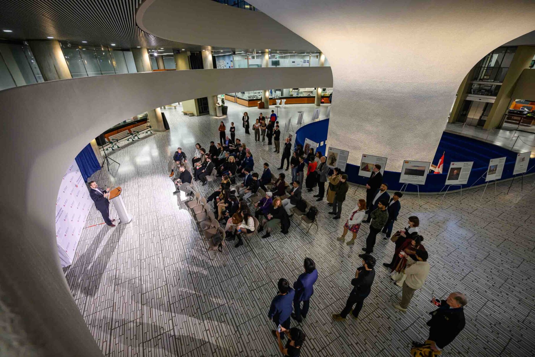 NAOC President Robert Baines addressing guests at the NATO art exhibition opening reception in Toronto