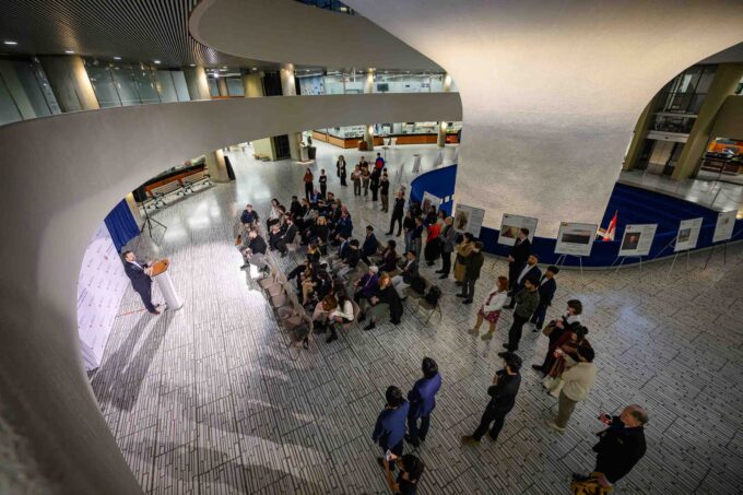 NAOC President Robert Baines addressing guests at the NATO art exhibition opening reception in Toronto