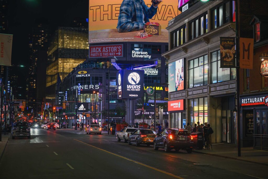 Digital billboard at Yonge and Dundas Square featuring Toronto photographer Nick Wons' cityscape images, June 2022