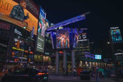 Rainy night King Street streetcar reflection image showcased on a rotating digital billboard in downtown Toronto