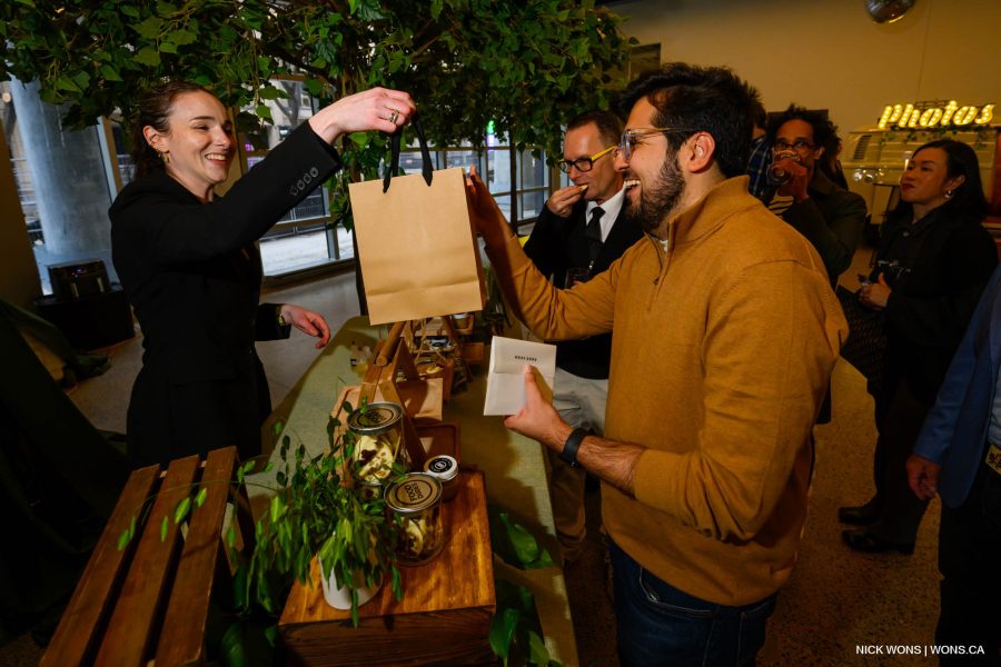 guest receiving gift bag at St Lawrence Market North open house event
