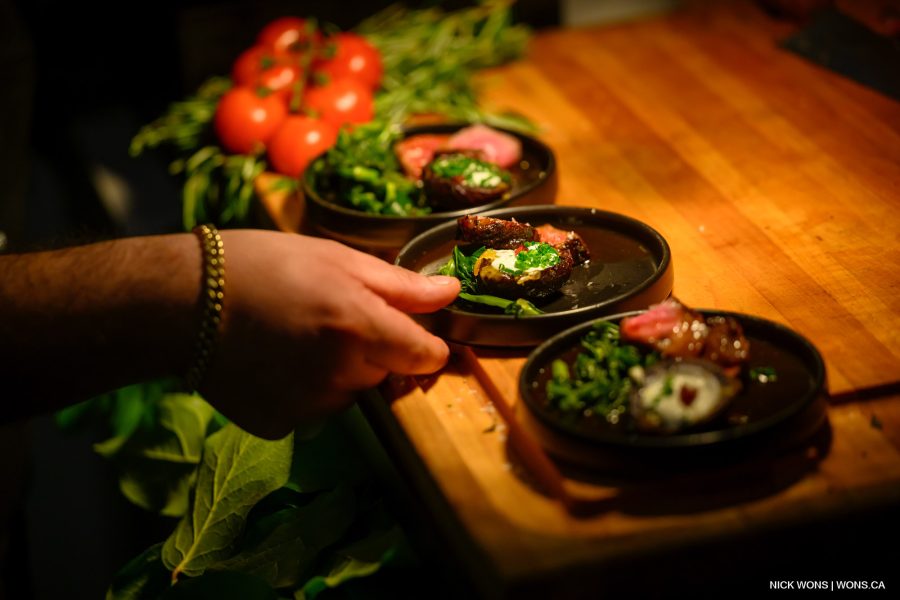 Close up of hand taking plate of food at St Lawrence Market North event industry open house